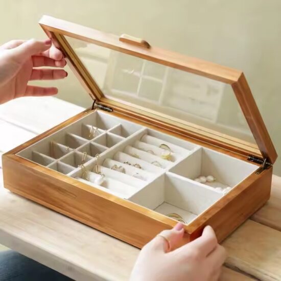 Compact wooden travel jewelry box with velvet compartments