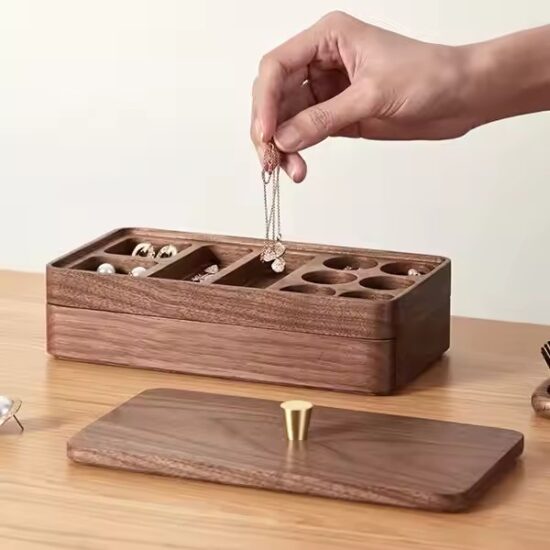 Compact wooden travel jewelry box with velvet compartments