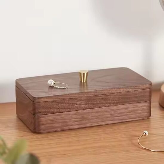 Compact wooden travel jewelry box with velvet compartments
