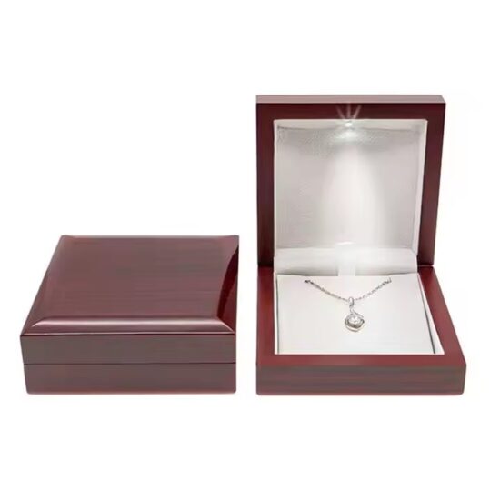 Luxury wooden jewelry box with ring slots and engraved logo