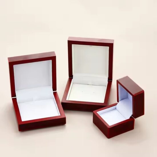 Luxury wooden jewelry box with ring slots and engraved logo