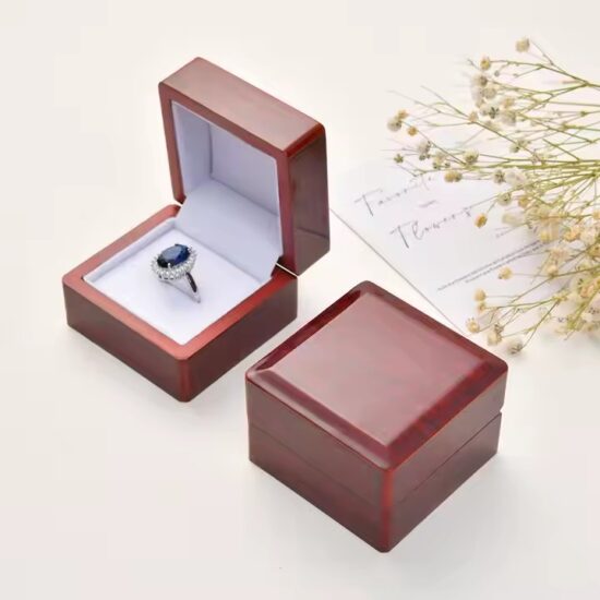 Luxury wooden jewelry box with ring slots and engraved logo