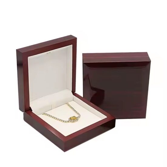 Luxury wooden jewelry box with ring slots and engraved logo