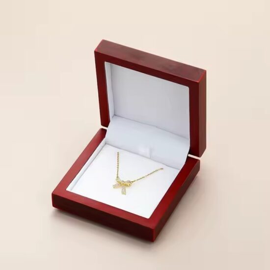 Luxury wooden jewelry box with ring slots and engraved logo