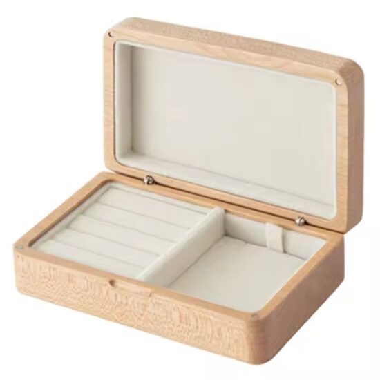 Vintage style wooden jewelry box with carved details and velvet interior

