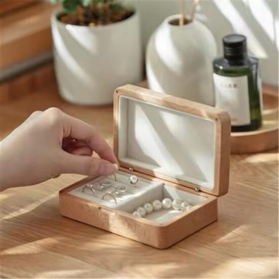 Vintage style wooden jewelry box with carved details and velvet interior

