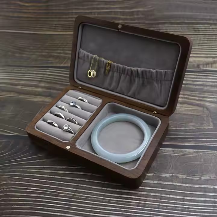High-end wooden jewelry box with velvet interior and multiple compartments